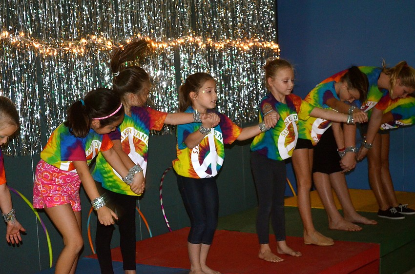 The girls take a bow after performing to a range of pop songs.