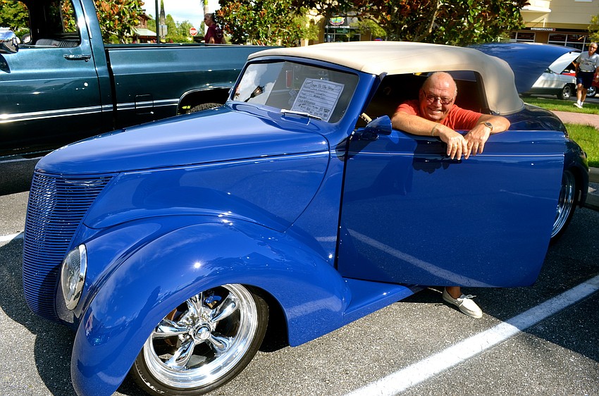 Dave Marfeo smiles inside of his '37 Ford Convertible.