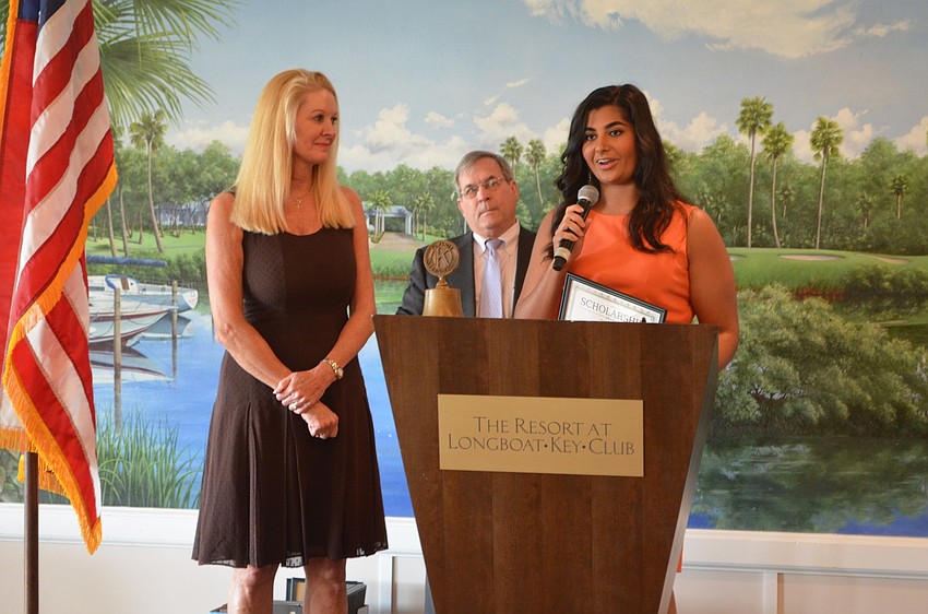Zachary Carroll, University of Florida, is awarded an academic scholarship by Scholarship Committee Chair Susan Philips and Longboat Kiwanis Club President Richard Crawford.