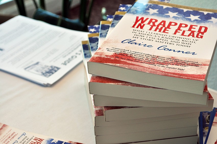 Featured speaker Claire Connorâ€™s book, Wrapped in the Flag, was available for purchase at the event.
