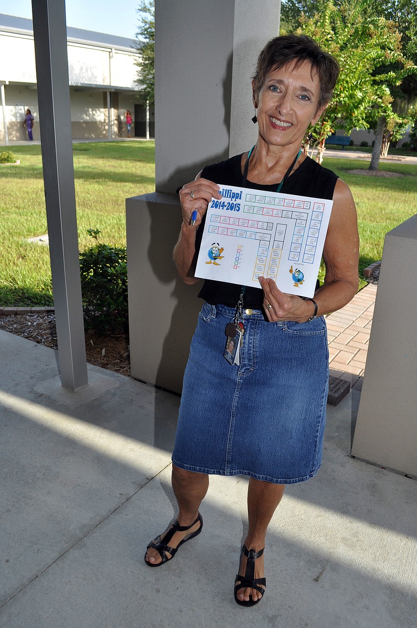Phillippi Shores Elementary Schoolâ€™s occupational therapist Elena Vizvary helps parents and students find their way to the classrooms.