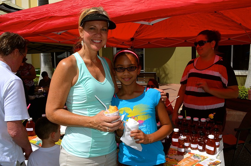 Sally and Sara Cestero enjoy a cold snack.