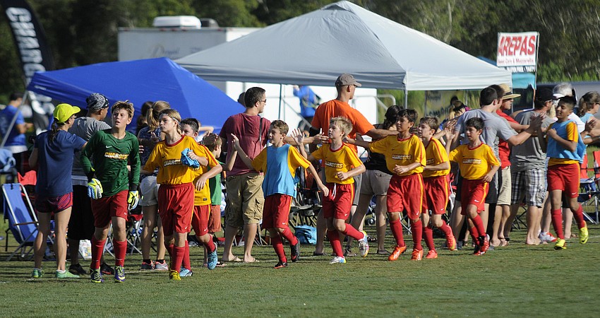 Fans congratulate the Clearwater Chargers U12 boys team on their effort following their game versus the Florida Rush Aug. 31.