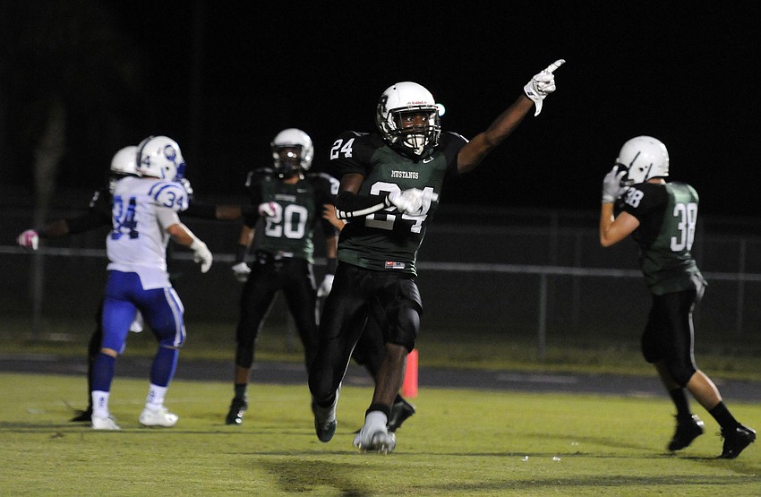 Lakewood Ranch defensive back Craig Bain celebrates following Daymon Murrayâ€™s interception in the end zone in the fourth quarter.