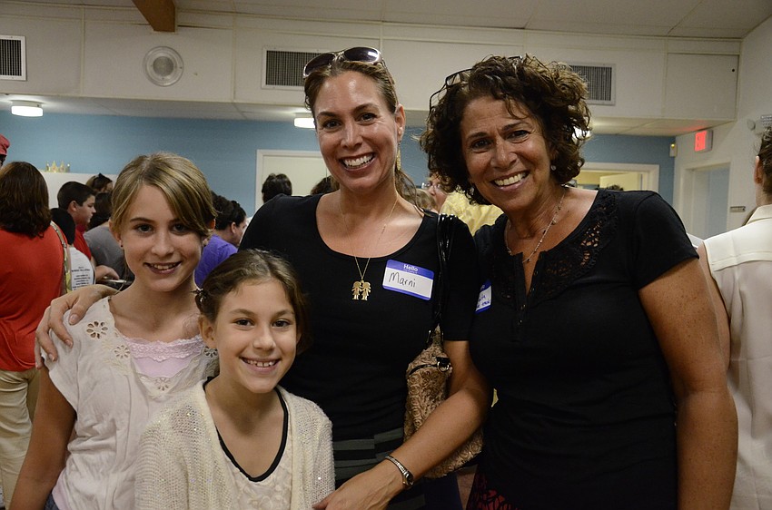 Natalie Mount (left), 12, her sister Abbie, 10, and her mom Marni met Abbie's 5th grade religious class teacher, 