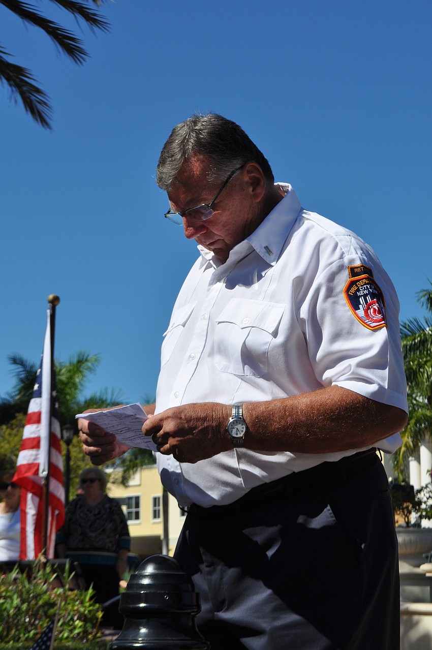 Jerry Ritzinger says a prayer during the ceremony.