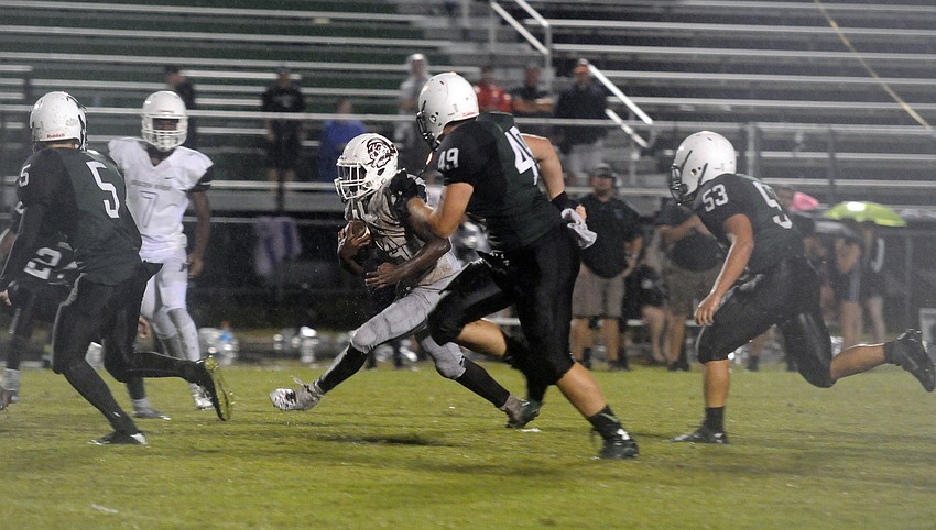 Running back Carlos Crawford carries the ball for Braden River late in the fourth quarter.
