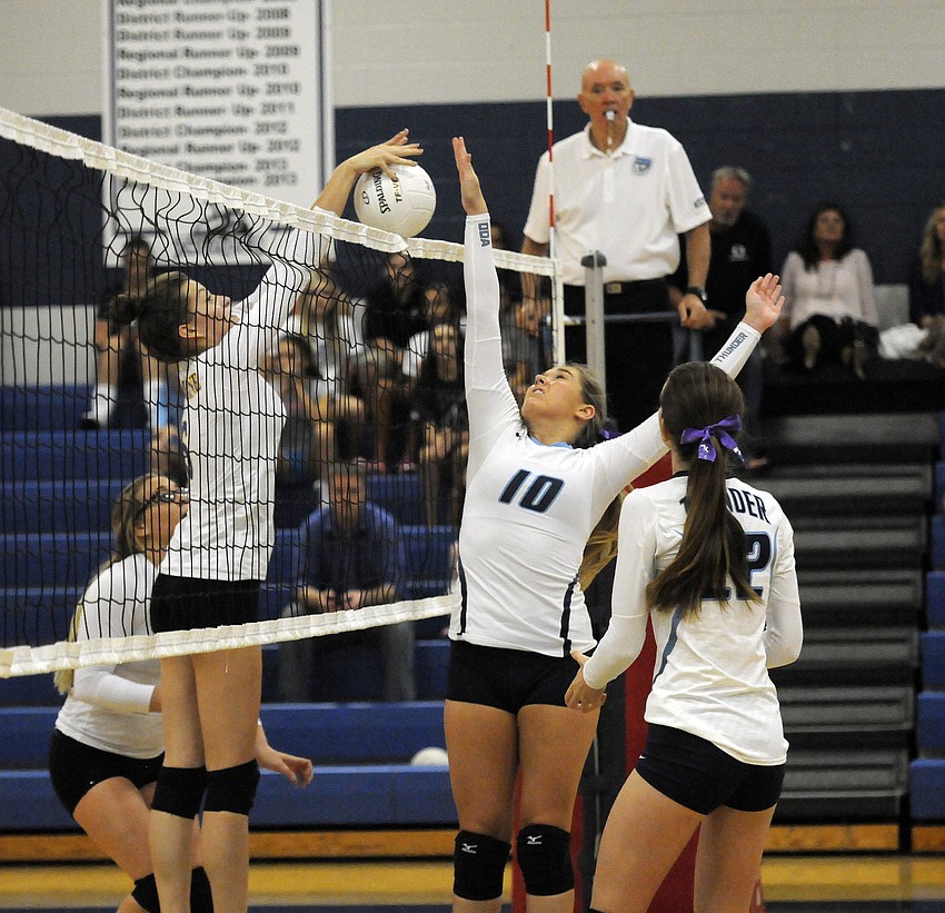 ODA junior Charlotte Dixon goes up for a block during the first set.
