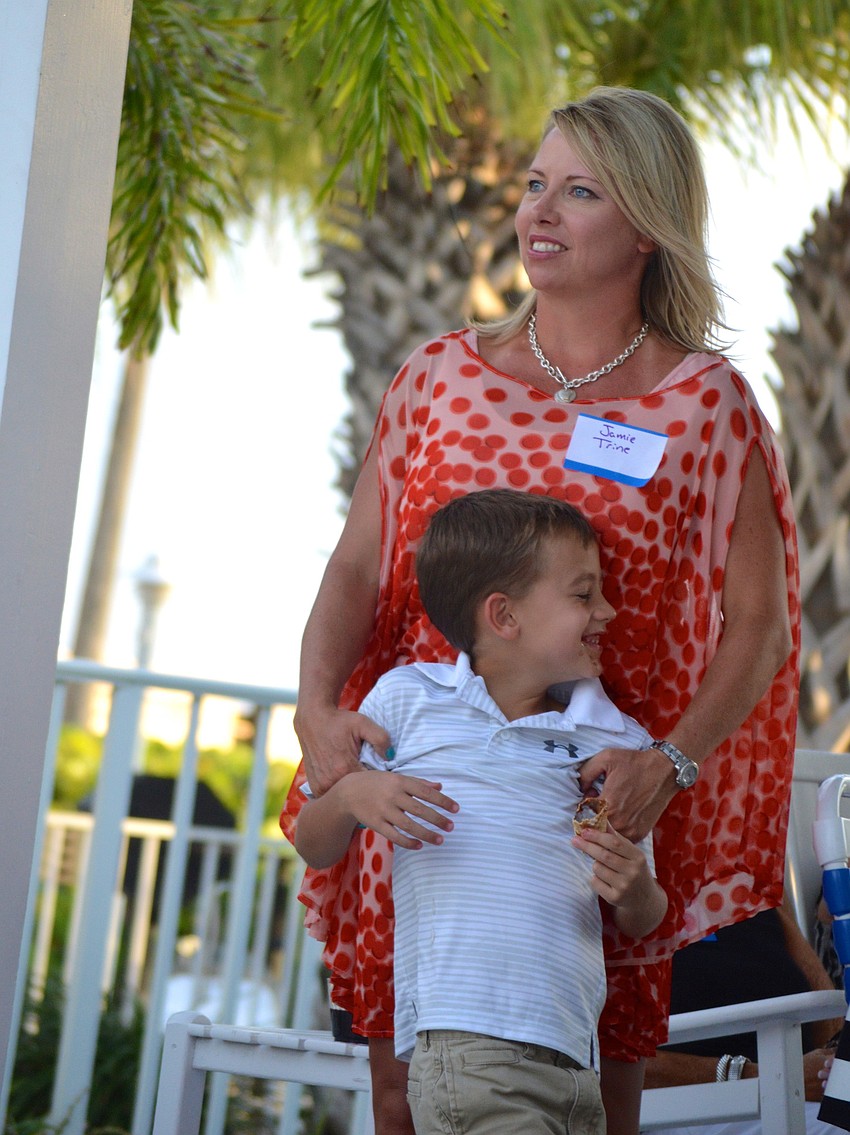 Jamie Trine plays with her son, Gage, 7, during Business After Hours at the Wicker Inn Sept. 25.