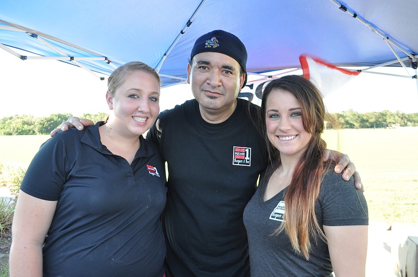Amanda Cutrona, Alex Chavez and Cherlyn Graber serve burgers for Square One Burgers.