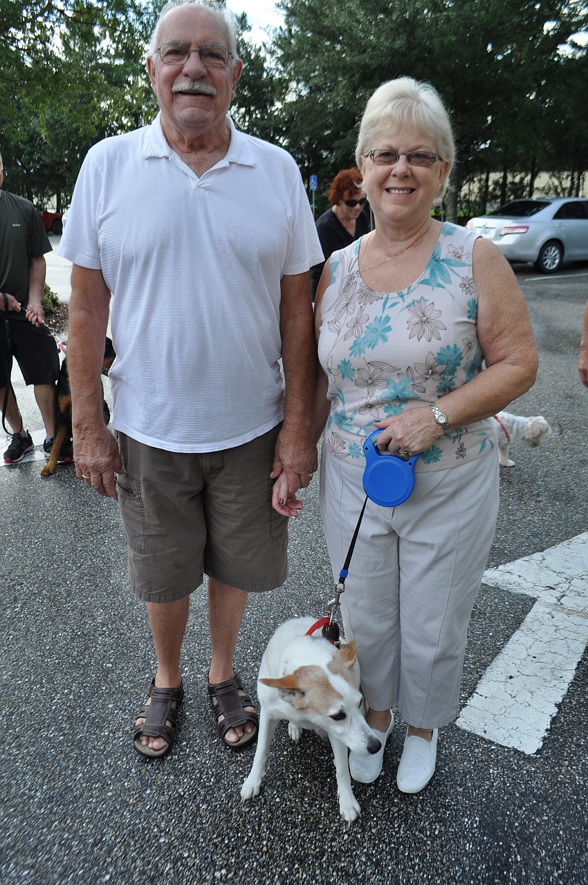 Jean and John Fry bring Miss Millie for a blessing.