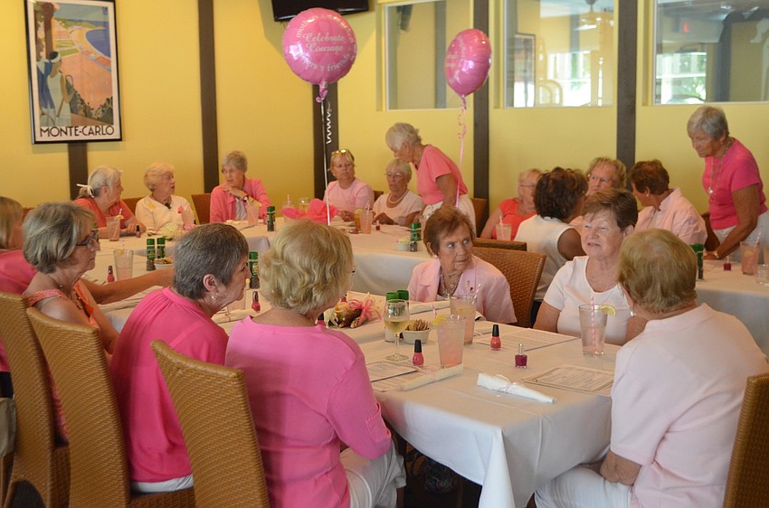 The women of Spanish Main Yacht Club celebrate those who have been touched with breast cancer.