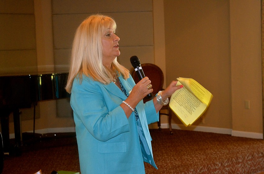 Melanie Brokaw updates members on club happenings.