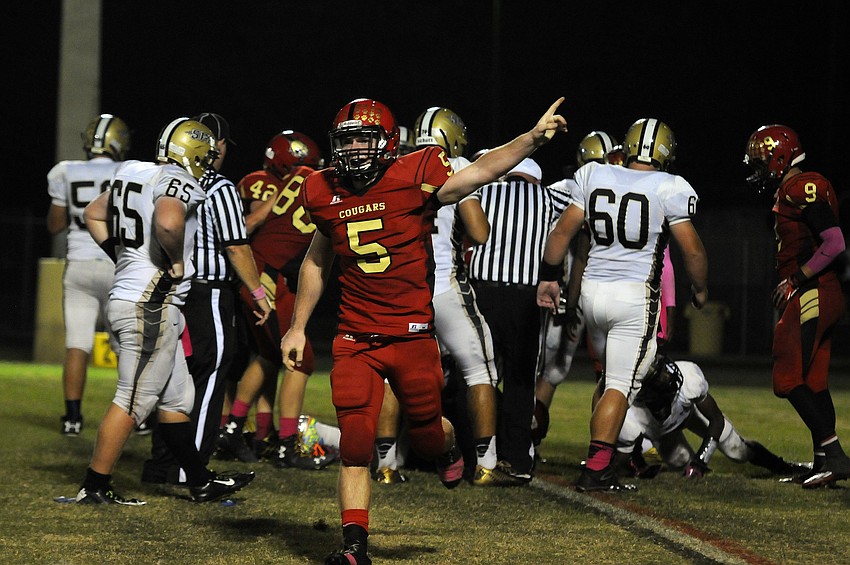Cardinal Mooney linebacker Nate Maxham celebrates following a fumble recovery in the second quarter.
