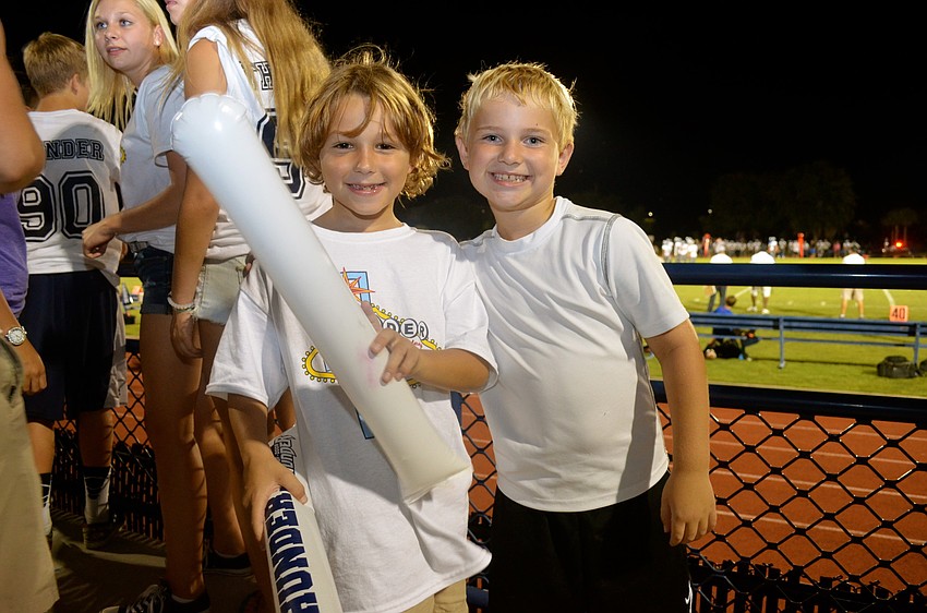 ODA students Caleb Cheney and Ryan Beck cheer on the football team.