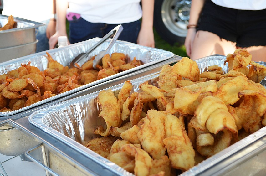 Waltâ€™s Fish Market and Restaurant served fried fish, fried shrimp, French fries, hush puppies and chicken tenders with a side of coleslaw for the event.