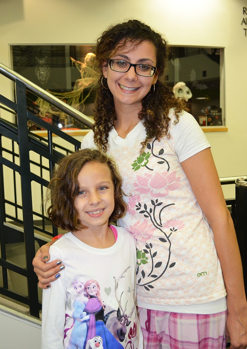 Sara Mayo attends the Scout About the Library event with her daughter Addyson.