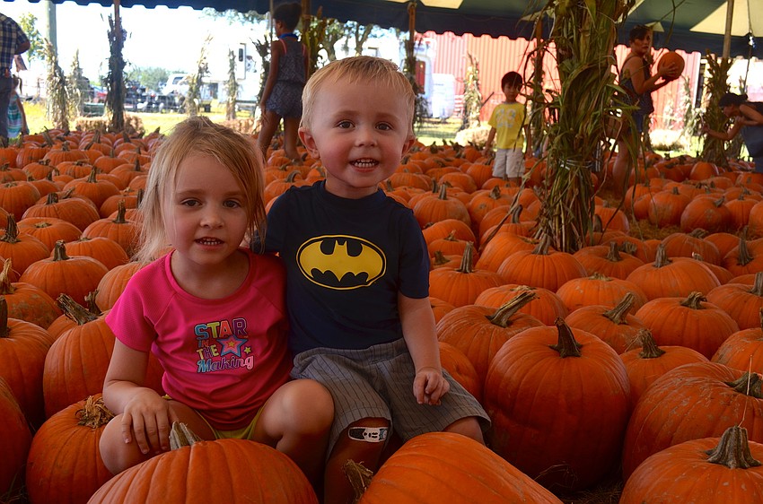 Sanorah and Obadiah Watson say â€œcheeseâ€ in the pumpkin patch.