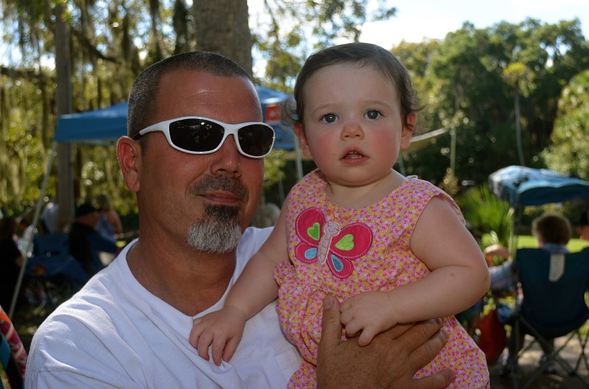 Jimmy Pollack smiles beside his daughter, Olivia.