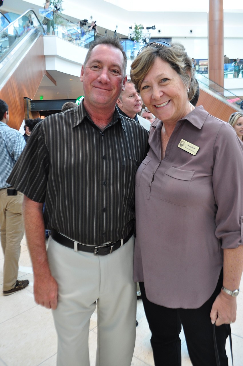 Dennis Malaney visits with Manatee County Commissioner Betsy Benac.