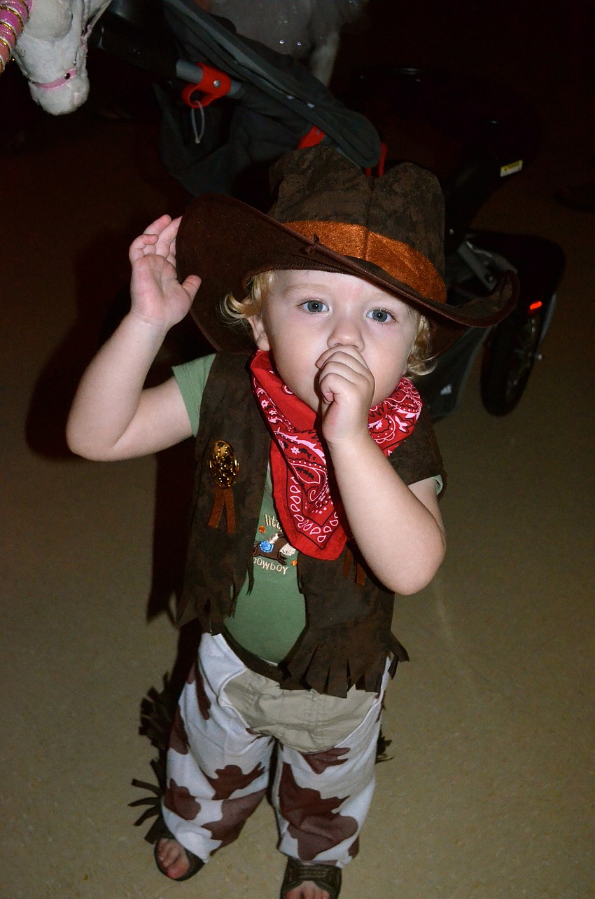 One of the event's youngest attendees, Reid Beddoe shows off his cowboy attire.