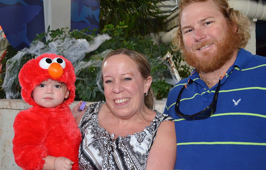 Lani May, Shauna and Will Froelich enjoy their time at the Mote Night of Fish, Fun and Fright.