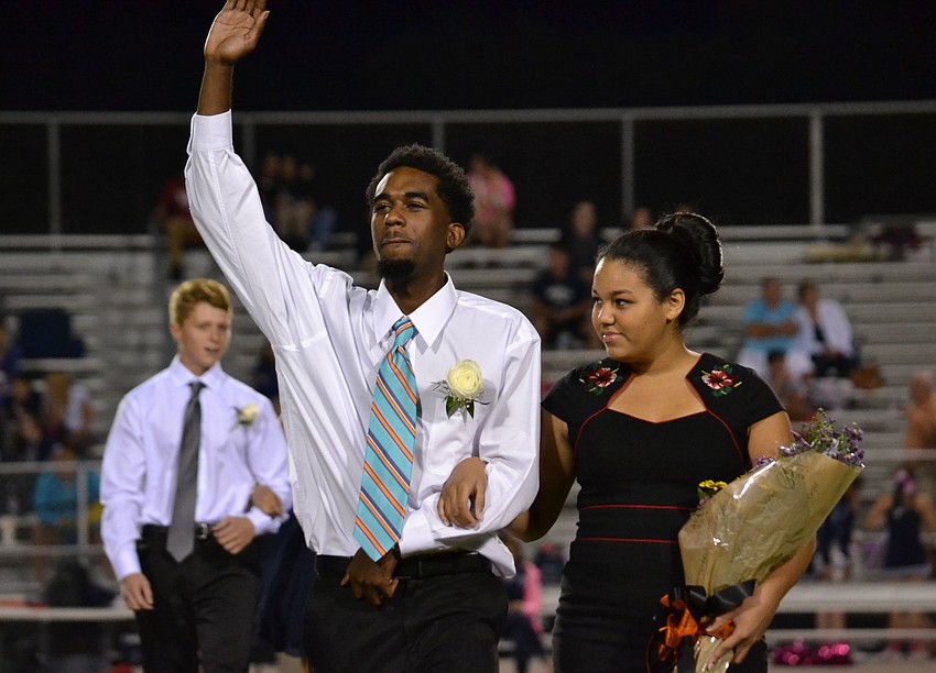 Travious Ringer escorts Debra Rivera on the Homecoming Court