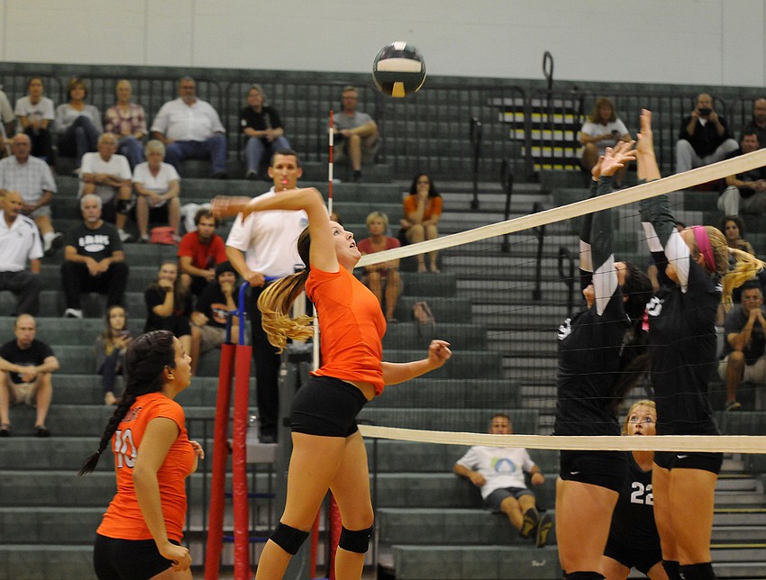 Toni Mongensen sends the ball back over the net for the Lady Sailors.