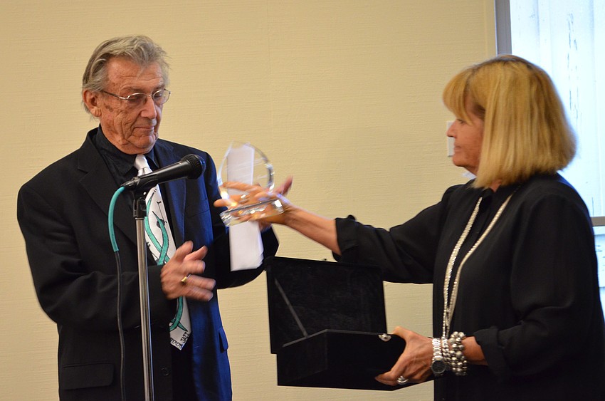 Al Hixon receives the Ageless Creativity award from Jane Buckman.