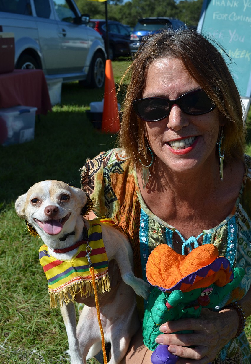 Maryann Horton holds her 1-year-old Chihuahua named Ginger.