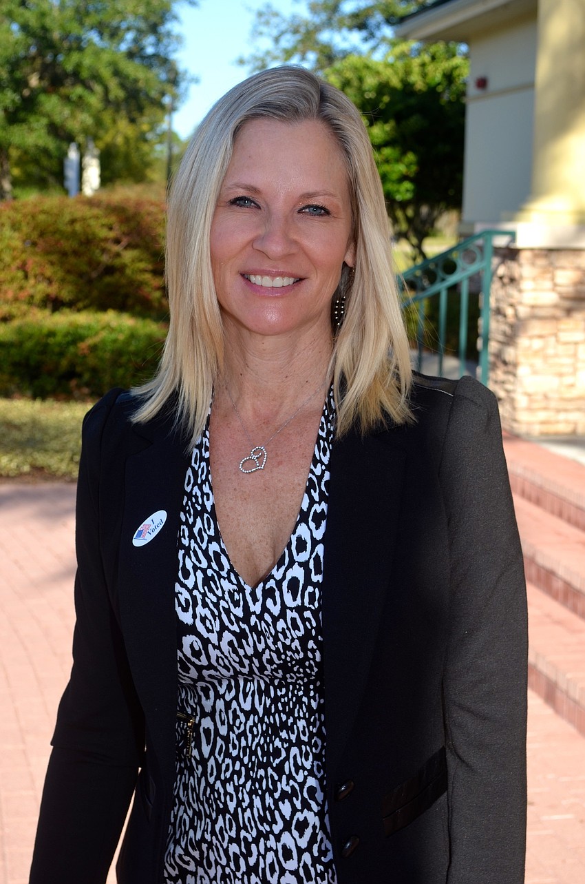 Shelley Lafoe stops to vote before work.