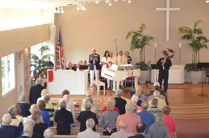 Trumpeter Daniel Mendelow and the Longboat Island Chapel choir perform â€œBattle Hymn of the Republic.â€