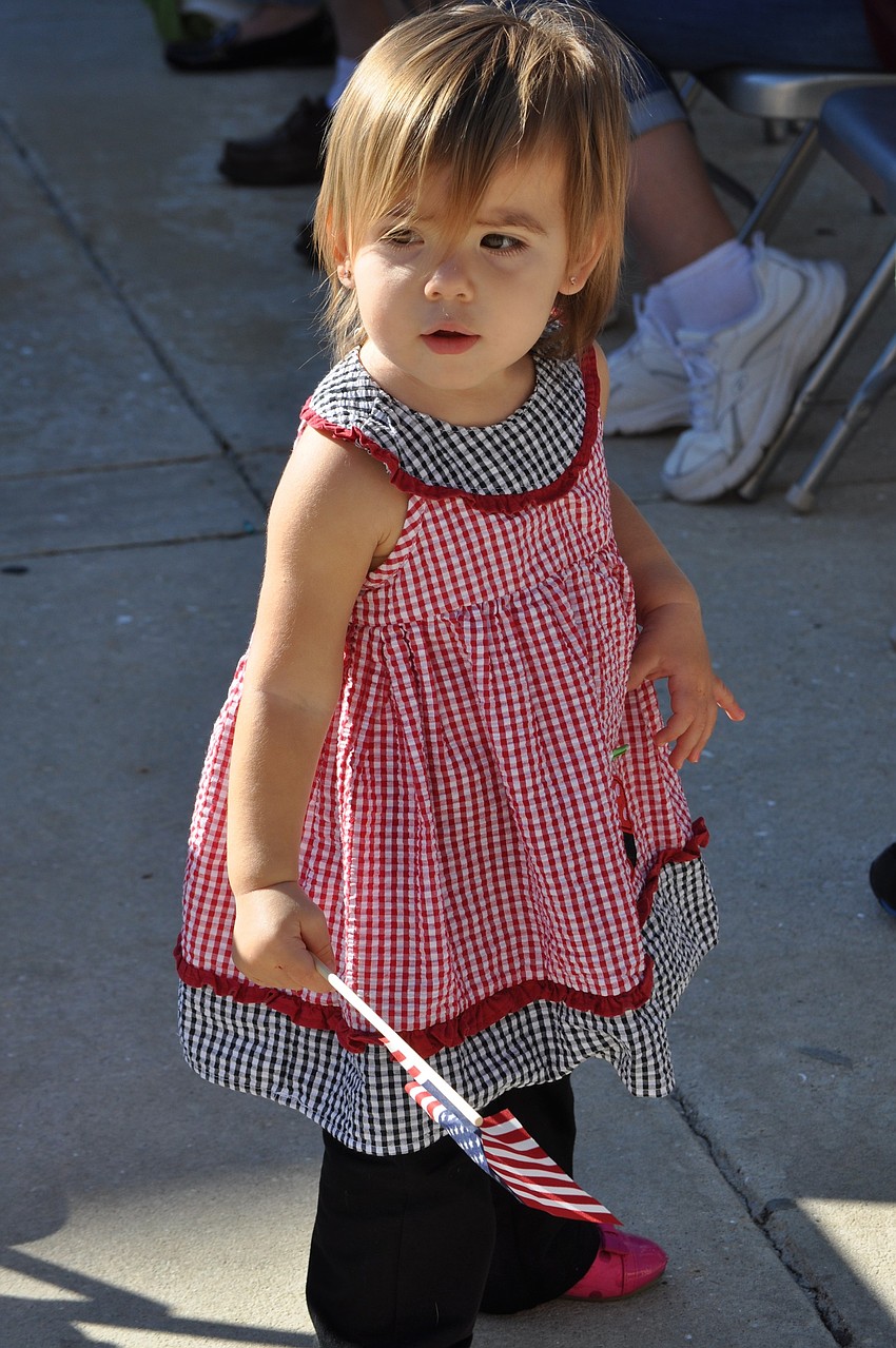 Lilliana Jurado, 15 months, waves her American flag.