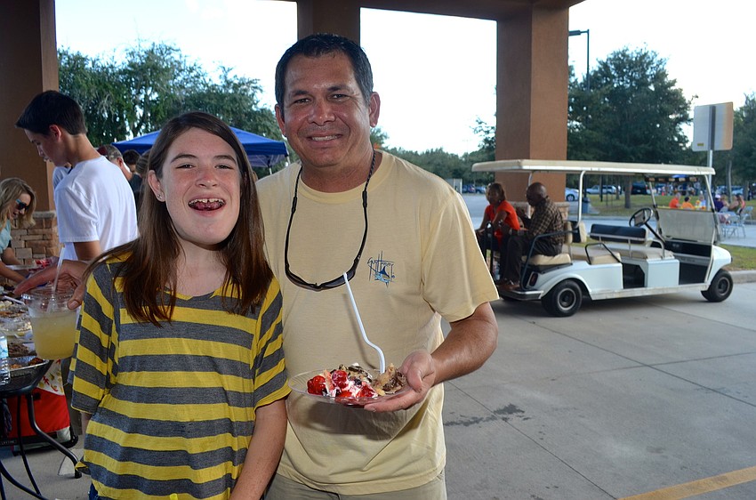 Hannah Claxton and her father, Jerry, satisfy their sweet teeth.