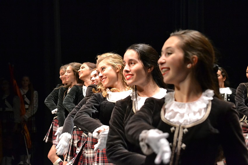 Highland Dancers accompany the Kiltie Marching Band.