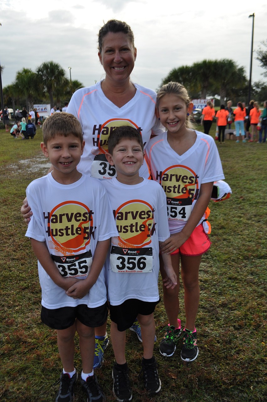 Denise Pope runs with her children, William, Andrew and Caroline.