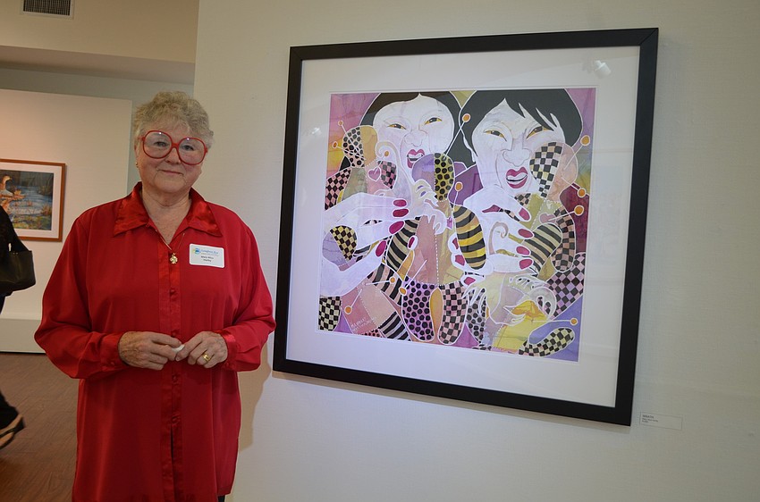 Mary Alice Harley with her painting titled â€œWRATH.â€ Harley received a second place award in the art show.