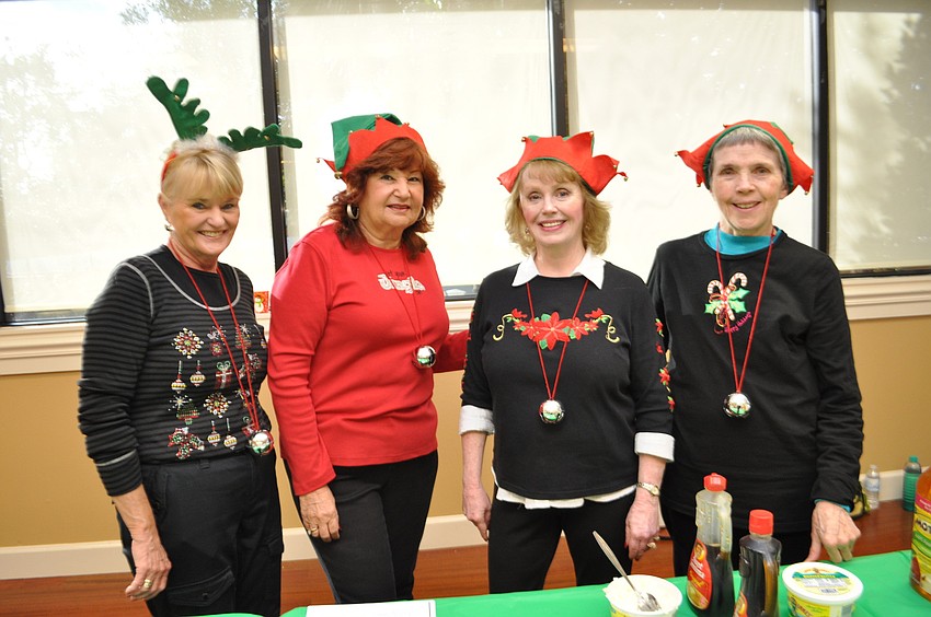 Sheila Boling, Marilyn Tropp, Sandra Anderson and Barbara Aulenbach serve pancakes, sausage and drinks.