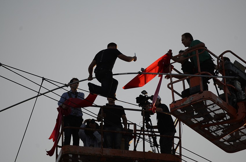 Nik Wallenda cuts the grand opening ribbon.