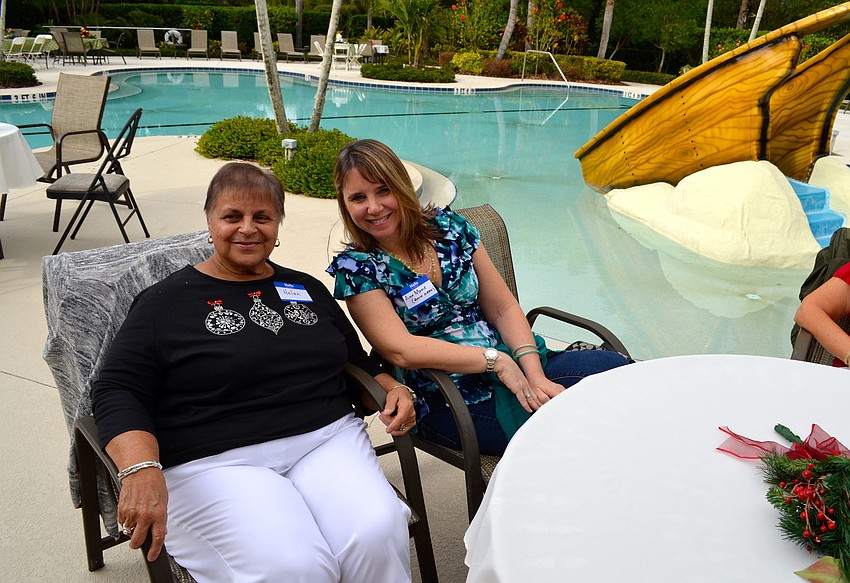 Helen Smalley and Ann Marie Grimes cheer for the band.