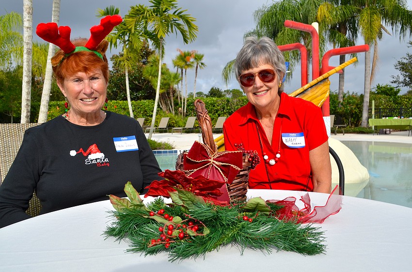 Linda Dolan and Nancy Bibbins show their Christmas spirit.