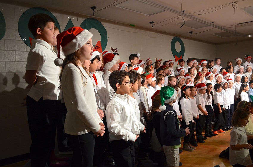 Third-grade students entertain their audience.