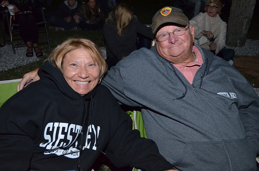 Deb and Pat Fimon wait for the boat parade to make its way down the bay to Marina Jack.
