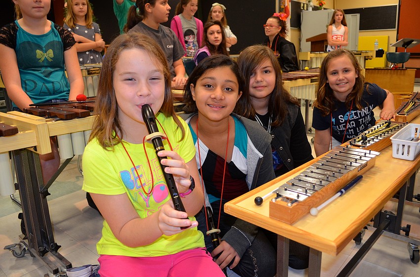 Riley Schlick-Trask, Aksheeta Sharma, Victoria Kelley and Elizabeth Wherry wait for the play to start.