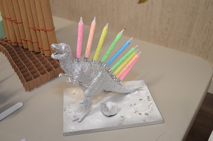 Students in the Temple Emanu-El Religious School made menorahs from different materials.