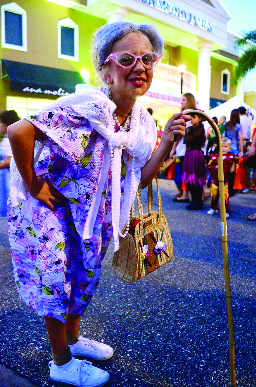 Eight-year-old Dakota Holler taps into her elderly side for Halloween during Boo Fest on Lakewood Ranch Main Street.