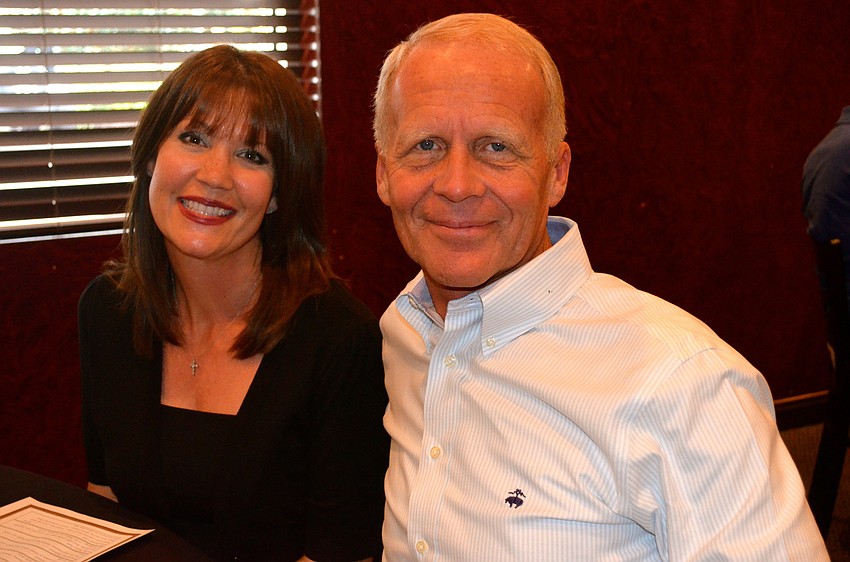 Holly Livingston and Jim Nelson socialize before the event starts.