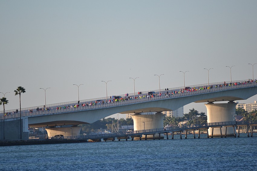 Runners make their way across the John Ringling Bridge early Saturday morning.