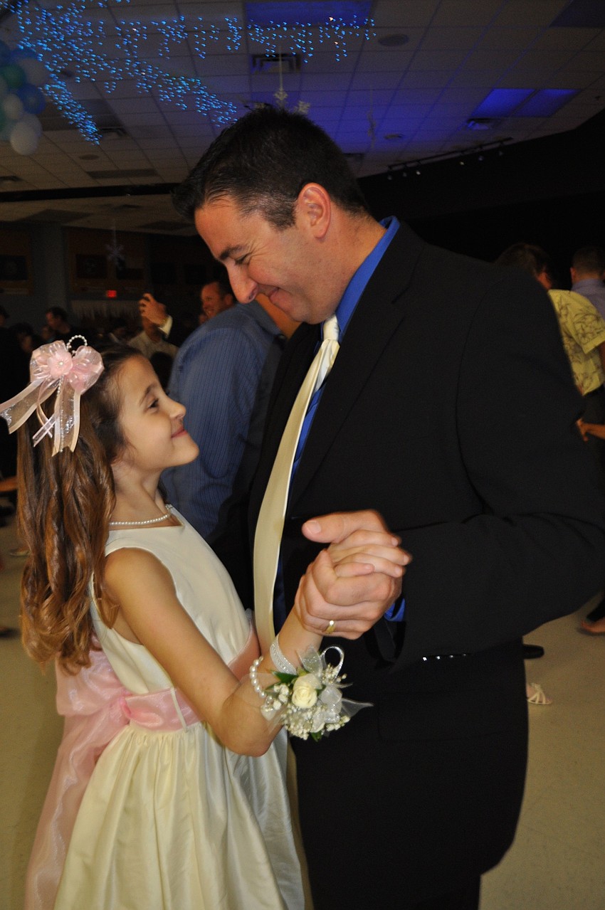 Sophia and Rob Mandarine dance to a slow tune.