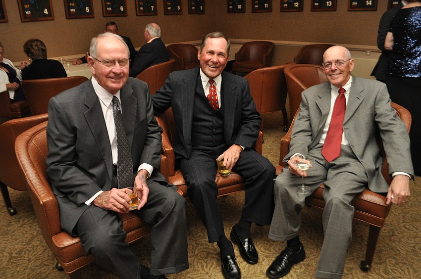 Dick Feltmer, Jim Donegan and Brian Ward enjoy drinks.